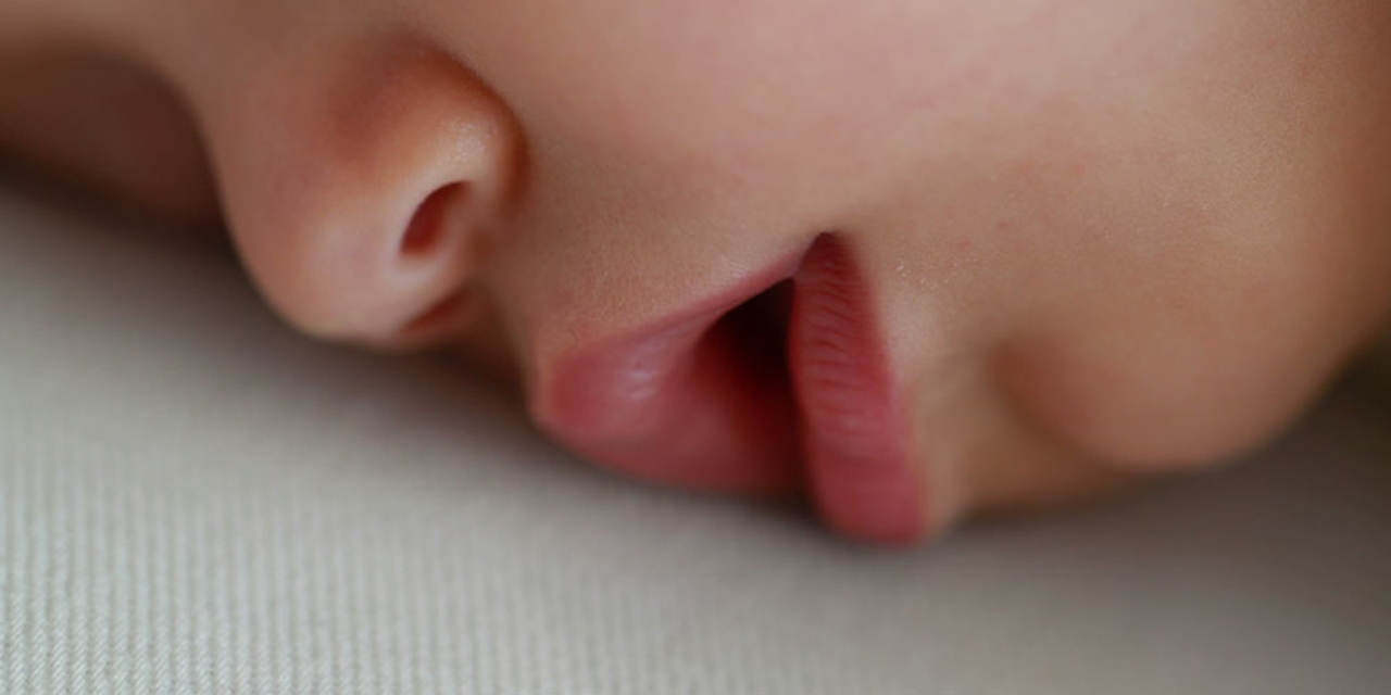 Close up on a baby's nose and mouth asleep