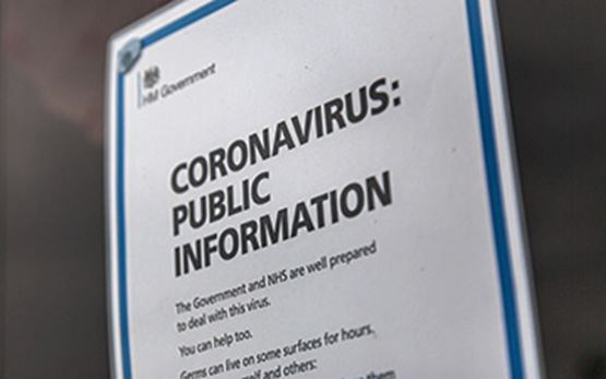 Sign on door with information on coronavirus
